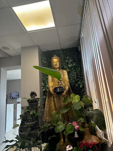 Thai statue and plant detail inside Patchara Thai Massage